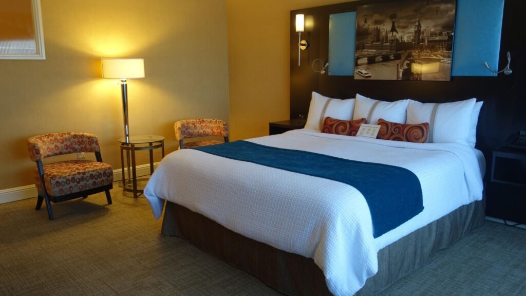 a hotel room with a bed showing Booking a Hotel Room Like a Pro