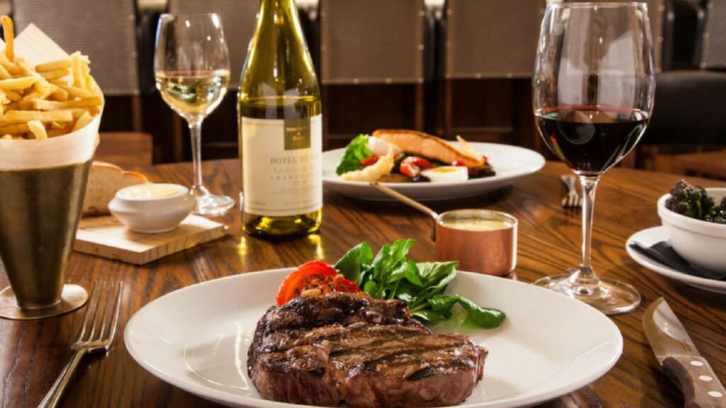 wine and food on the table showing trying New Wines at Hotel Restaurants