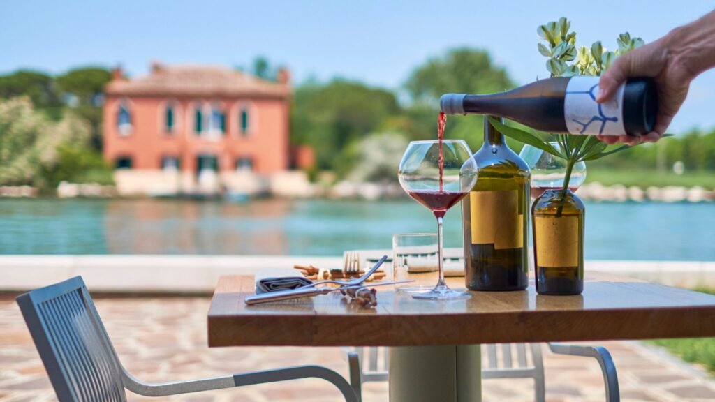 a man pouring wine in a glass showing Local Wineries 