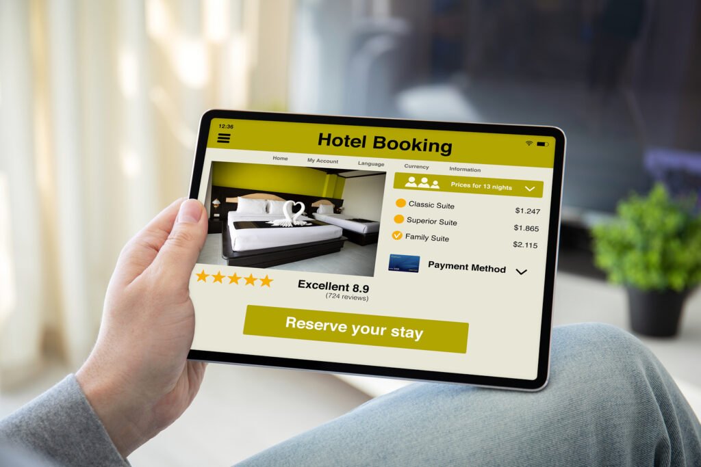 man hands holding computer tablet with app hotel booking on the screen in the home room showing the concept of how to handle hotel booking mistakes 