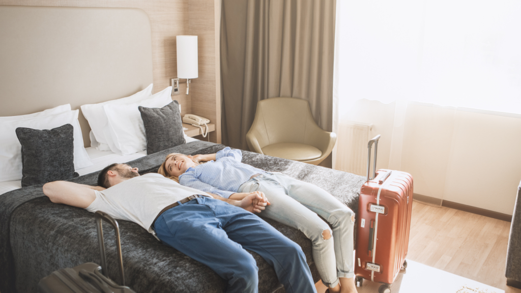 A Couple on top a Hotel Bed