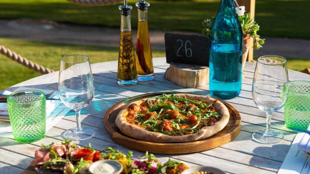 Pizza and some drinks on a table